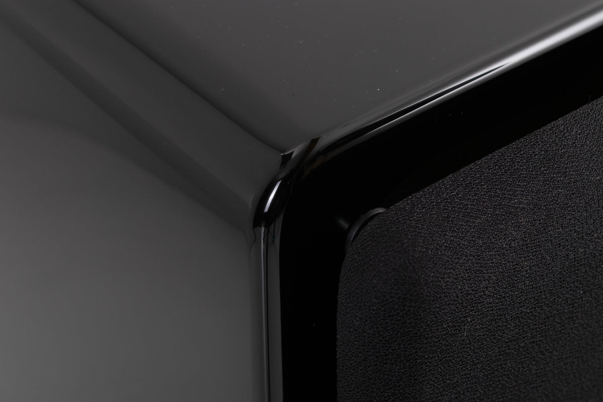 Front left corner of a used XTZ SA-1 Subwoofer in a Gloss Black finish