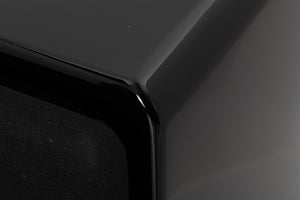 Front right corner of a used XTZ SA-1 Subwoofer in a Gloss Black finish