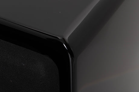 Front right corner of a used XTZ SA-1 Subwoofer in a Gloss Black finish