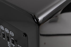 Rear left corner of a used XTZ SA-1 Subwoofer in a Gloss Black finish