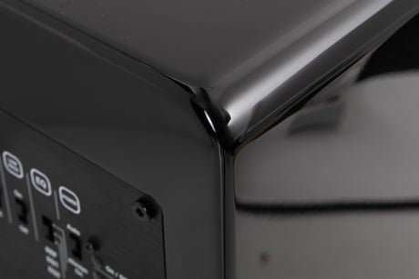 Rear left corner of a used XTZ SA-1 Subwoofer in a Gloss Black finish