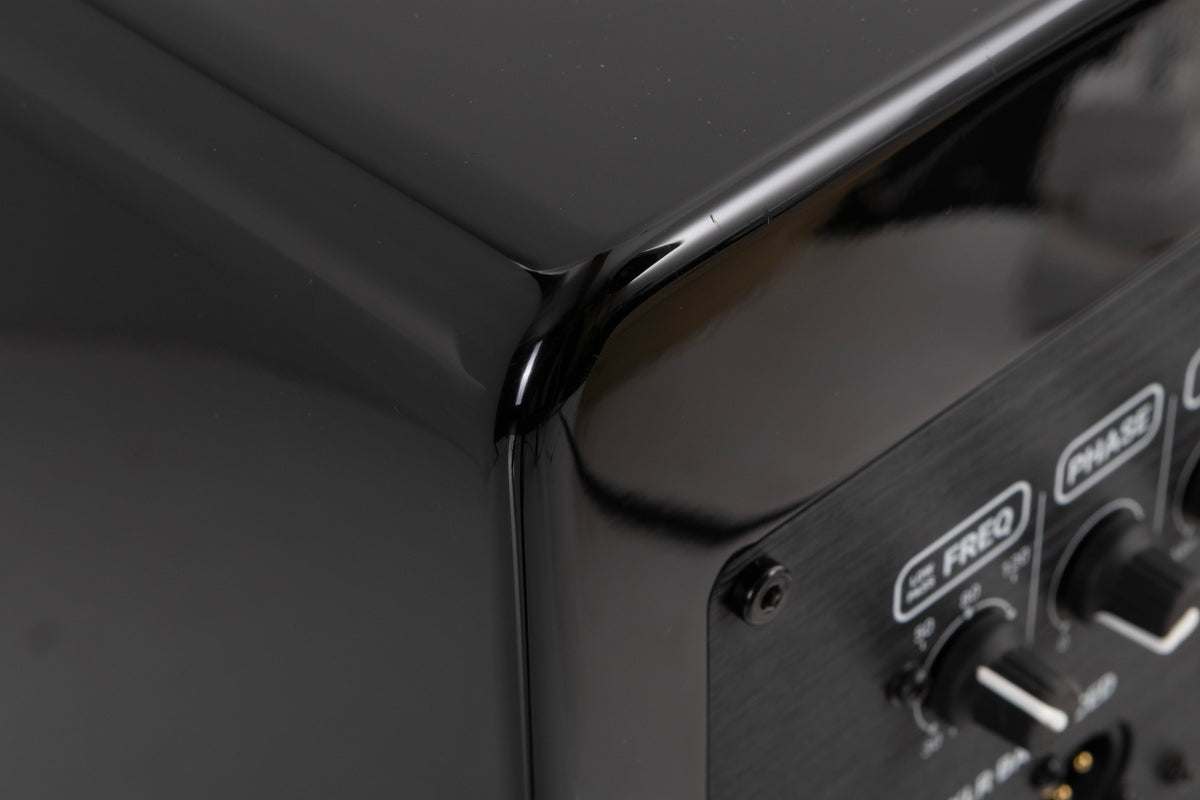 Rear right corner of a used XTZ SA-1 Subwoofer in a Gloss Black finish