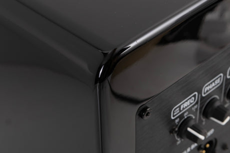 Rear right corner of a used XTZ SA-1 Subwoofer in a Gloss Black finish