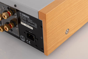 Rear left corner of a used Yamaha A-S2000 Integrated Amplifier in a Silver finish