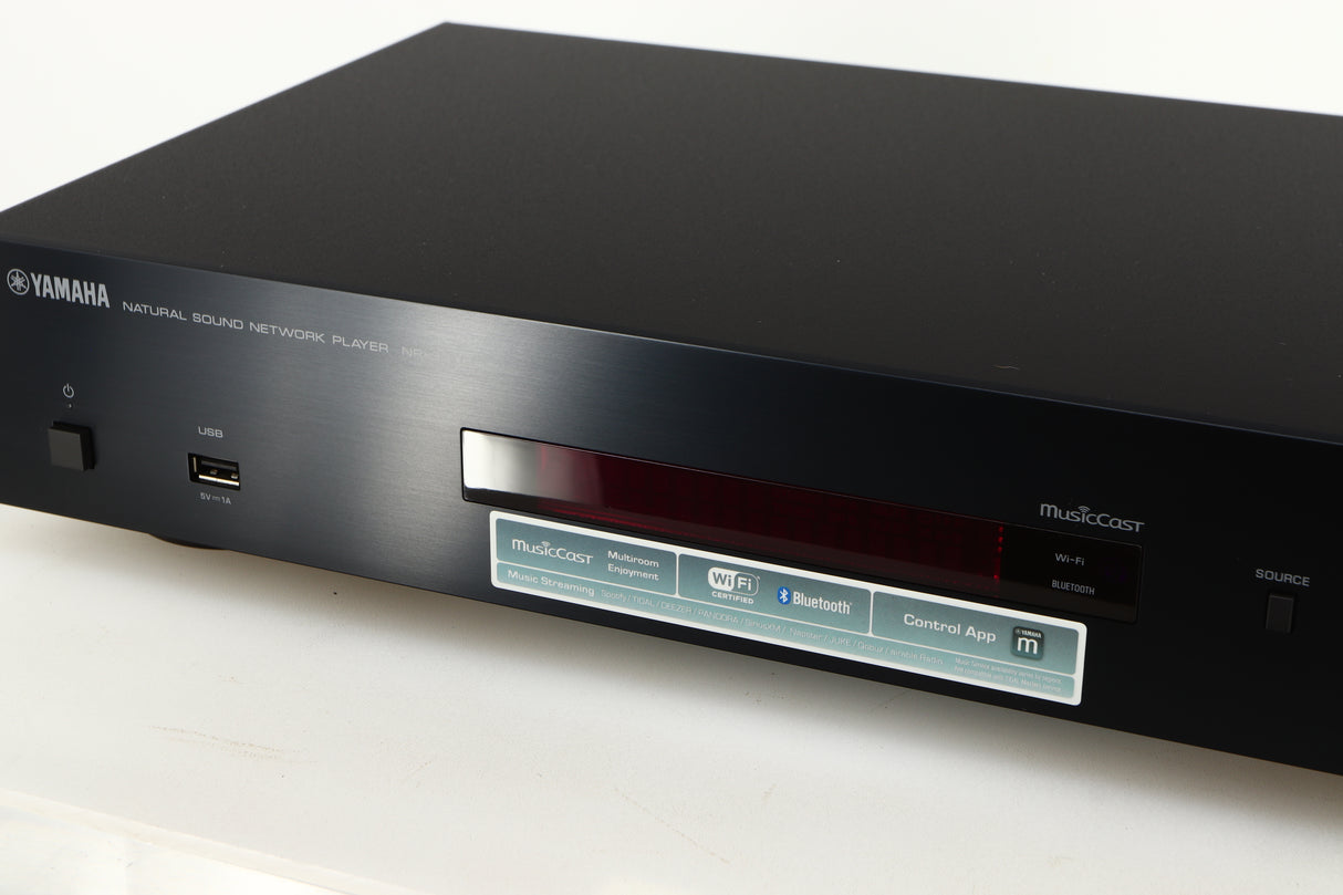 Close up of a used Yamaha NP-S303 Musicast Streamer in a black finish showing some of the fascia