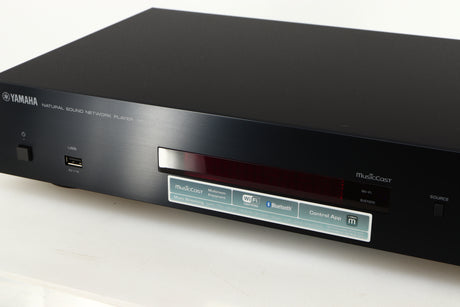 Close up of a used Yamaha NP-S303 Musicast Streamer in a black finish showing some of the fascia