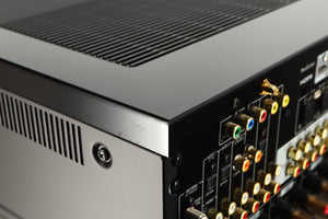 Close up of a used Yamaha RX-A8A Aventage AV Receiver in a black finish showing marks near rear right corner