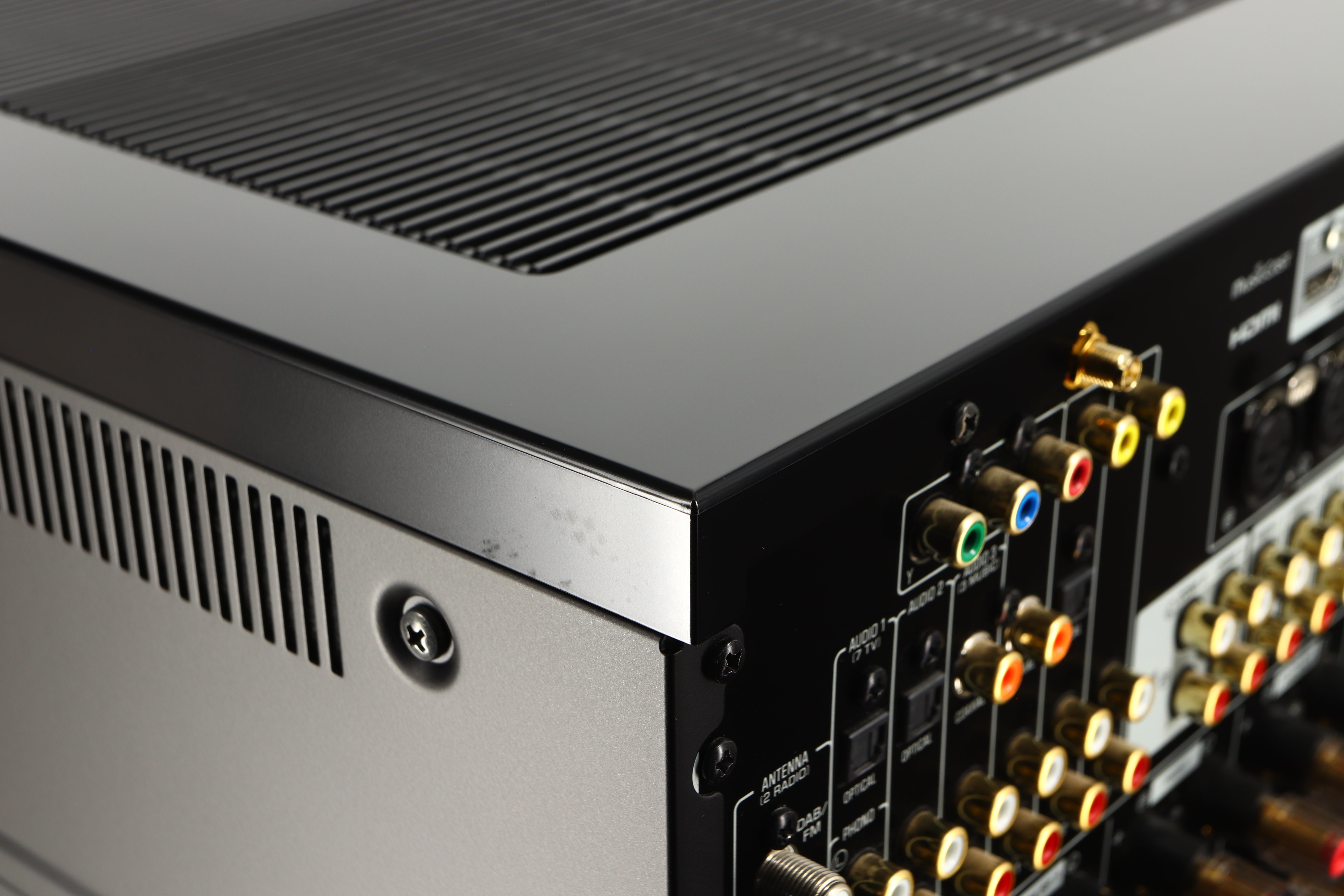Close up of a used Yamaha RX-A8A Aventage AV Receiver in a black finish showing marks near rear right corner