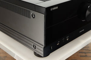 Front left corner of a used Yamaha RX-A8A Aventage AV Receiver in a black finish