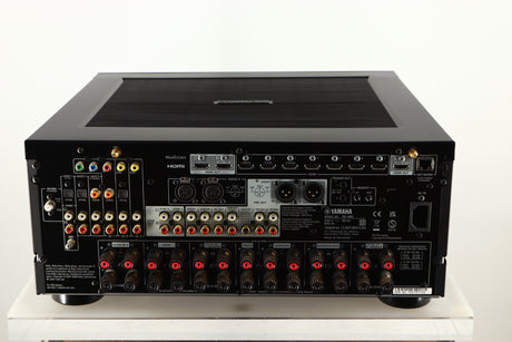 Rear view of a used Yamaha RX-A8A Aventage AV Receiver in a black finish showing Phono Inputs, Phono Outputs, Mains Input, HDMI Inputs, HDMI Outputs, Optical Outputs, Optical Inputs, Network Input and Speaker Outputs
