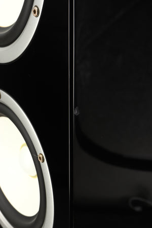 Close up of a used Yamaha Soavo 1 Floorstanding Speaker in a piano black finish showing chip on front right corner