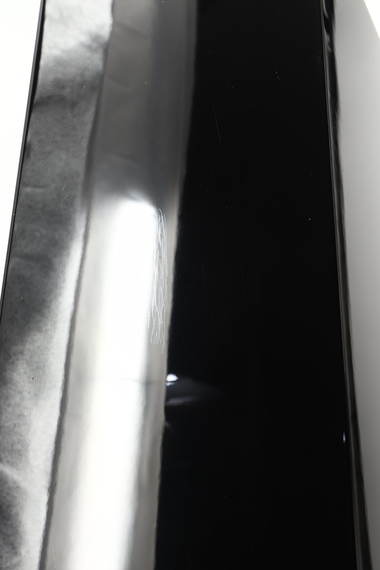Close up of a used Yamaha Soavo 1 Floorstanding Speaker in a piano black finish showing scratching on rear