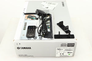 Box for a used Yamaha WXC-50 Streaming Pre Amplifier in a silver finish showing Remote, Power Cable, Aerial, Manual and 2x Wall Mounts