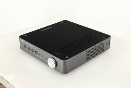 Front right corner of a used Yamaha WXC-50 Streaming Pre Amplifier in a silver finish
