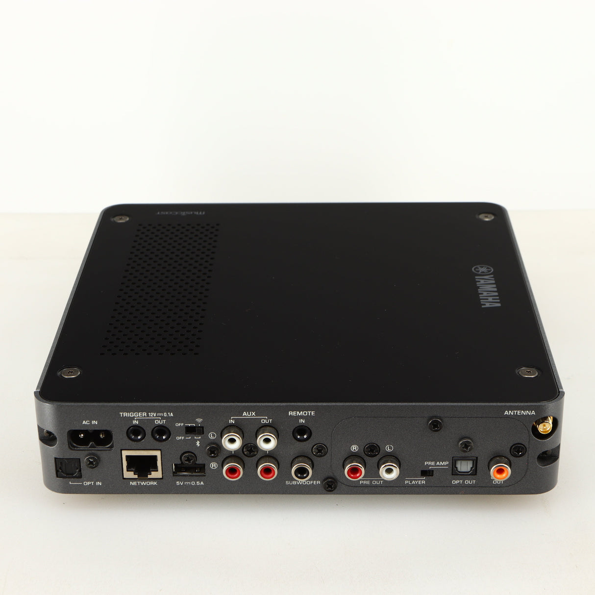 Rear view of a used Yamaha WXC-50 Streaming Pre Amplifier in a silver finish showing Phono Inputs, Phono Outputs, Network Input, Optical Output, Optical Input, USB Input and Power Input