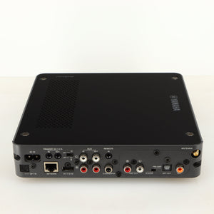 Rear view of a used Yamaha WXC-50 Streaming Pre Amplifier in a silver finish showing Phono Inputs, Phono Outputs, Network Input, Optical Output, Optical Input, USB Input and Power Input