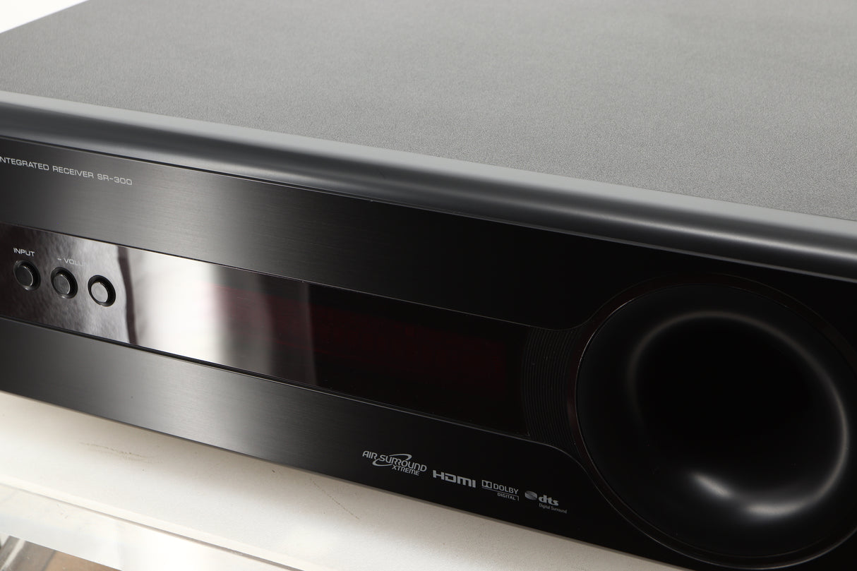 Close up view of a used Yamaha SR-300 Integrated Receiver in a black finish showing scratching on screen